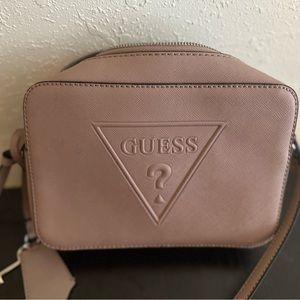 Blush small crossbody purse by Guess.